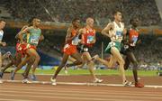25 August 2004; Ireland's Mark Carroll (2127) and Kenya's Eliud Kipchoge (2342) lead the field during their heat of the Men's 5000m. Olympic Stadium. Games of the XXVIII Olympiad, Athens Summer Olympics Games 2004, Athens, Greece. Picture credit; Brendan Moran / SPORTSFILE