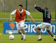 2 September 2004; Republic of Ireland's Robbie Keane in action against Stephen Carr during squad training. Malahide FC, Malahide, Co. Dublin. Picture credit; Matt Browne / SPORTSFILE
