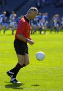 29 August 2004; Referee Jimmy White solos the ball as the Laois minor team warm up before the match. All-Ireland Minor Football Championship Semi-Final, Kerry v Laois, Croke Park, Dublin. Picture credit; Brian Lawless / SPORTSFILE