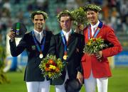 27 August 2004; Ireland's Cian O'Connor, centre, Gold Medallist, Rodrigo Pessoa, left, of Brazil, Silver Medallist, and Chris Kappler, of the USA, Bronze Medallist in the Individual Jumping Competition. Markopoulo Olympic Equestrian Centre. Games of the XXVIII Olympiad, Athens Summer Olympics Games 2004, Athens, Greece. Picture credit; Brendan Moran / SPORTSFILE