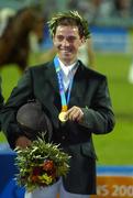 27 August 2004; Ireland's Cian O'Connor with his Gold Medal after winning the Individual Jumping Competition. Markopoulo Olympic Equestrian Centre. Games of the XXVIII Olympiad, Athens Summer Olympics Games 2004, Athens, Greece. Picture credit; Brendan Moran / SPORTSFILE