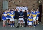 28 September 2013; Pat Quill, President, Ladies Gaelic Football Association, and Lynn Moynihan, from TESCO Ireland, presents Castleknock GAA Club with their runners-up trophy after the TESCO All-Ireland Ladies Football Club sevens Junior final, during the 2013 TESCO Ladies Football 7s, Naomh Mearnóg GAA Club, Portmarnock, Co. Dublin. Picture credit: Matt Browne / SPORTSFILE