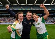 29 September 2013; Offaly's Orla Heavey, left, and Emma Dalton celebrate with manager Greg Farrelly after the game. TG4 All-Ireland Ladies Football Junior Championship Final, Offaly v Wexford, Croke Park, Dublin. Photo by Sportsfile