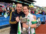 29 September 2013; Offaly captain Siobhan Flannery celebrates with manager Eamonn Ryan and the West County Hotel cup after the game. TG4 All-Ireland Ladies Football Junior Championship Final, Offaly v Wexford, Croke Park, Dublin. Photo by Sportsfile