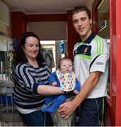 29 September 2013; Clare's Pat O'Connor with 3 month old Brian Tierney and his mother Sadie, from Thurles, Co. Tipperary, and the Liam MacCarthy cup on a visit by the All-Ireland Senior Hurling Champions to Our Lady's Hospital for Sick Children, Crumlin. Picture credit: Matt Browne / SPORTSFILE