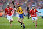 28 September 2013; Rory Deegan, from Cullahill PS, Cullahill, Co. Laois, representing Clare, in action against Ryan McCarthy, from St. Fergal's NS, Killeagh, Co. Cork, left, and Tiarnan O'Rourke, from St Corbans NS, Naas, Co. Kildare, representing Cork. INTO/RESPECT Exhibition GoGames during the GAA Hurling All-Ireland Senior Championship Final Replay between Cork and Clare, Croke Park, Dublin. Picture credit: Stephen McCarthy / SPORTSFILE
