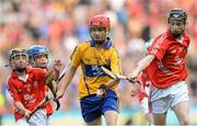 28 September 2013; Conor Hoban, from Dunnamaggin NS, Dunnamaggin, Co. Kilkenny, representing Clare, in action against Cian Sparling, from St. Nicholas NS, Adare, Co. Limerick, representing Cork, left, and Kieran Conroy, from Paddock NS, Mountrath, Co. Laois, representing Cork, right. INTO/RESPECT Exhibition GoGames during the GAA Hurling All-Ireland Senior Championship Final Replay between Cork and Clare, Croke Park, Dublin. Picture credit: Stephen McCarthy / SPORTSFILE