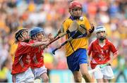 28 September 2013; Conor Hoban, from Dunnamaggin NS, Dunnamaggin, Co. Kilkenny, representing Clare, in action against Cian Sparling, from St. Nicholas NS, Adare, Co. Limerick, representing Cork, left, and Tiarnan O'Rourke, from St Corbans NS, Naas, Co. Kildare, representing Cork. INTO/RESPECT Exhibition GoGames during the GAA Hurling All-Ireland Senior Championship Final Replay between Cork and Clare, Croke Park, Dublin. Picture credit: Stephen McCarthy / SPORTSFILE