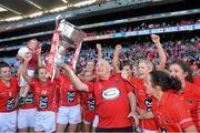 29 September 2013; Cork manager Eamonn Ryan and the team celebrate with the Brendan Martin cup after the game. TG4 All-Ireland Ladies Football Senior Championship Final, Cork v Monaghan, Croke Park, Dublin. Picture credit: Ray McManus / SPORTSFILE