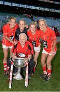 29 September 2013; Cork players, from left, Juliet Murphy, Elanie Harte, Briege Corkery, Bríd Stack and manager Eamonn Ryan celebrate with the Brendan Martin cup after the game. TG4 All-Ireland Ladies Football Senior Championship Final, Cork v Monaghan, Croke Park, Dublin. Picture credit: Ray McManus / SPORTSFILE
