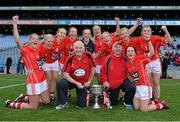 29 September 2013; Cork players who have won 8 All-Ireland Championships, from left, Juliet Murphy, Deirdre O'Reilly, Nollaig Cleary, Rena Buckley, Elanie Harte, Bríd Stack, Angela Walsh, Valerie Mulcahy, Briege Corkery and Geraldine O'Flynn, celebrate with manager Eamonn Ryan, selector Frankie Honohan and the Brendan Martin cup after the game. TG4 All-Ireland Ladies Football Senior Championship Final, Cork v Monaghan, Croke Park, Dublin. Picture credit: Brendan Moran / SPORTSFILE