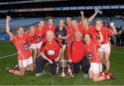 29 September 2013; Cork players who have won 8 All-Ireland Championships, from left, Juliet Murphy, Deirdre O'Reilly, Nollaig Cleary, Rena Buckley, Elanie Harte, Bríd Stack, Angela Walsh, Valerie Mulcahy, Briege Corkery and Geraldine O'Flynn, celebrate with manager Eamonn Ryan, selector Frankie Honohan and the Brendan Martin cup after the game. TG4 All-Ireland Ladies Football Senior Championship Final, Cork v Monaghan, Croke Park, Dublin. Picture credit: Ray McManus / SPORTSFILE