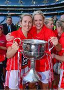 29 September 2013; Cork players Nollaig Cleary, left, and Angela Walsh, celebrate with the Brendan Martin cup after the game. TG4 All-Ireland Ladies Football Senior Championship Final, Cork v Monaghan, Croke Park, Dublin. Photo by Sportsfile