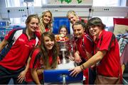 30 September 2013; Cork players, from left, Ann Marie Walsh, Brid Stack, Orlagh Farmer, Angela Walsh, Annie Walsh and Jess O'Shea with Aimee Fenton, age 11, from Midleton, Co. Cork, and the Brendan Martin cup on a visit by the All-Ireland Ladies Football Champions to Temple Street Children's University Hospital, Temple Street, Dublin.  Picture credit: Brendan Moran / SPORTSFILE