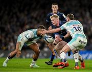 18 January 2025; Jamie Osborne of Leinster in action against Ollie Lawrence and Finn Russell of Bath during the Investec Champions Cup Pool 2 match between Leinster and Bath at the Aviva Stadium in Dublin. Photo by Brendan Moran/Sportsfile