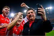 19 January 2025; Cuala supporter Des Cahill celebrates with the Cuala players after their victory in the AIB GAA Football All-Ireland Senior Club Championship final match between Cuala and Errigal Ciarán at Croke Park in Dublin. Photo by Ben McShane/Sportsfile