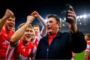 19 January 2025; Cuala supporter Des Cahill celebrates with the Cuala players after their victory in the AIB GAA Football All-Ireland Senior Club Championship final match between Cuala and Errigal Ciarán at Croke Park in Dublin. Photo by Ben McShane/Sportsfile