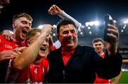 19 January 2025; Cuala supporter Des Cahill celebrates with the Cuala players after their victory in the AIB GAA Football All-Ireland Senior Club Championship final match between Cuala and Errigal Ciarán at Croke Park in Dublin. Photo by Ben McShane/Sportsfile