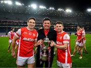 19 January 2025; Cuala supporter Des Cahill with James Power, left, and Luke Keating as they celebrate with the Andy Merrigan Cup after the AIB GAA Football All-Ireland Senior Club Championship final match between Cuala and Errigal Ciarán at Croke Park in Dublin. Photo by Piaras Ó Mídheach/Sportsfile