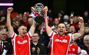 19 January 2025; Cuala players Cathal Ó Giolláin, left, and Luke Tracey lift the Andy Merrigan Cup after their side's victory in the the AIB GAA Football All-Ireland Senior Club Championship final match between Cuala and Errigal Ciarán at Croke Park in Dublin. Photo by Ben McShane/Sportsfile