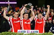 19 January 2025; Cuala players, from left, Con O'Callaghan, Niall O'Callaghan and Eoghan O'Callaghan lift the Andy Merrigan Cup after their side's victory in the the AIB GAA Football All-Ireland Senior Club Championship final match between Cuala and Errigal Ciarán at Croke Park in Dublin. Photo by Ben McShane/Sportsfile