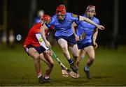 23 January 2025; James Duggan of UCD in action against Ciaran Joyce of MTU Cork during the Electric Ireland Higher Education GAA Fitzgibbon Cup round two match between University College Dublin and Munster Technological University Cork at Billings Park in Belfield, Dublin. Photo by Seb Daly/Sportsfile