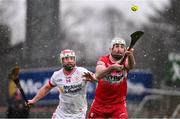 25 January 2025; Mark Craig of Derry in action against Kiefer Morgan of Tyrone during the Allianz Hurling League Division 2 match between Tyrone and Derry at O'Neills Healy Park in Omagh, Tyrone. Photo by Ramsey Cardy/Sportsfile