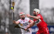 25 January 2025; Mark Craig of Derry in action against Kiefer Morgan of Tyrone during the Allianz Hurling League Division 2 match between Tyrone and Derry at O'Neills Healy Park in Omagh, Tyrone. Photo by Ramsey Cardy/Sportsfile
