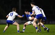 25 January 2025; Gerard Smith of Cavan is tackled by Monaghan players, from left, Micheal Bannigan, Killian Lavelle and Ryan Wylie during the Allianz Football League Division 2 match between Cavan and Monaghan at Kingspan Breffni in Cavan. Photo by Ben McShane/Sportsfile