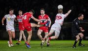 25 January 2025; Frank Burns of Tyrone blocks an attempted two-point score by Shane McGuigan of Derry during the Allianz Football League Division 1 match between Tyrone and Derry at O'Neills Healy Park in Omagh, Tyrone. Photo by Ramsey Cardy/Sportsfile
