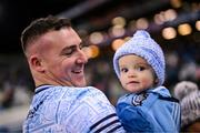 25 January 2025; John Hetherton of Dublin celebrates with his 1-year-old son Jack after the Allianz Hurling League Division 1B match between Dublin and Antrim at Croke Park in Dublin. Photo by Stephen McCarthy/Sportsfile