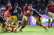 24 January 2025; Gavin Coombes of Munster is tackled by Chris Coleman of Dragons during the United Rugby Championship match between Dragons and Munster at Rodney Parade in Newport, Wales. Photo by Gareth Everett/Sportsfile