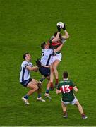 25 January 2025; Conor Reid and Fergal Boland, 13, of Mayo in action against James Madden, left, and Brian Howard of Dublin during the Allianz Football League Division 1 match between Dublin and Mayo at Croke Park. Photo by Stephen McCarthy/Sportsfile