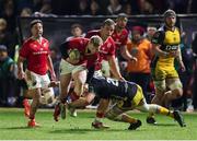 24 January 2025; Ethan Coughlan of Munster is tackled by George Young of Dragons during the United Rugby Championship match between Dragons and Munster at Rodney Parade in Newport, Wales. Photo by Gareth Everett/Sportsfile
