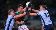 25 January 2025; Matthew Ruane of Mayo is tackled by Cian Murphy, left, and Sean Bugler of Dublin during the Allianz Football League Division 1 match between Dublin and Mayo at Croke Park. Photo by Ray McManus/Sportsfile