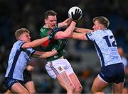 25 January 2025; Matthew Ruane of Mayo is tackled by Cian Murphy, left, and Sean Bugler of Dublin during the Allianz Football League Division 1 match between Dublin and Mayo at Croke Park. Photo by Ray McManus/Sportsfile