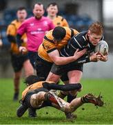26 January 2025; Shane McGuinness of Wexford Wanderers is tackled by Daniel Holmes and Sean Lambe of Ashbourne during the Bank of Ireland Provincial Towns Cup Round 1 match between Ashbourne RFC and Wexford Wanderers RFC at Milltown House in Ashbourne, Meath. Photo by Seb Daly/Sportsfile