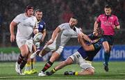 26 January 2025; John Cooney of Ulster is tackled by Matteo Canali of Zebre Parma during the United Rugby Championship match between Ulster and Zebre Parma at Kingspan Stadium in Belfast. Photo by Ramsey Cardy/Sportsfile