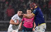 26 January 2025; John Cooney of Ulster is tackled by Matteo Canali of Zebre Parma during the United Rugby Championship match between Ulster and Zebre Parma at Kingspan Stadium in Belfast. Photo by Ramsey Cardy/Sportsfile