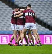 26 January 2025; Conor Loftus of Crossmolina Deel Rovers, hidden, is congratulated by team-mates including Cillian Fergus, 19, after scoring a penalty in the final moments of the game during the AIB GAA Football All-Ireland Intermediate Club Championship final match between Ballinderry of Derry and Crossmolina Deel Rovers of Mayo at Croke Park in Dublin. Photo by Tyler Miller/Sportsfile