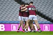 26 January 2025; Conor Loftus of Crossmolina Deel Rovers, hidden, is congratulated by team-mates including Cillian Fergus, 19, after scoring a penalty in the final moments of the game during the AIB GAA Football All-Ireland Intermediate Club Championship final match between Ballinderry of Derry and Crossmolina Deel Rovers of Mayo at Croke Park in Dublin. Photo by Tyler Miller/Sportsfile