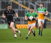 26 January 2025; Cathal Flynn of Offaly in action against Paul Kilcoyne of Sligo during the Allianz Football League Division 3 match between Offaly and Sligo at Glenisk O'Connor Park in Tullamore, Offaly. Photo by Matt Browne/Sportsfile