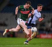 25 January 2025; Matthew Ruane of Mayo races clear of Greg McEneaney of Dublin during the Allianz Football League Division 1 match between Dublin and Mayo at Croke Park. Photo by Ray McManus/Sportsfile