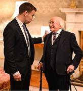 30 January 2025; President of Ireland Michael D. Higgins with Republic of Ireland captain Séamus Coleman before receiving a Presidential Distinguished Service Award for the Irish Abroad at Áras an Uachtaráin in Dublin. The Awards recognise the service given to this country or to Irish communities abroad by those who live outside Ireland. Photo by Stephen McCarthy/Sportsfile
