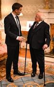 30 January 2025; President of Ireland Michael D. Higgins with Republic of Ireland captain Séamus Coleman before receiving a Presidential Distinguished Service Award for the Irish Abroad at Áras an Uachtaráin in Dublin. The Awards recognise the service given to this country or to Irish communities abroad by those who live outside Ireland. Photo by Stephen McCarthy/Sportsfile