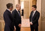 30 January 2025; Republic of Ireland captain Séamus Coleman, right, with An Taoiseach Micheál Martin TD and Tánaiste Simon Harris TD, left, before being presented with a Presidential Distinguished Service Award for the Irish Abroad by President of Ireland Michael D. Higgins at Áras an Uachtaráin in Dublin. The Awards recognise the service given to this country or to Irish communities abroad by those who live outside Ireland. Photo by Stephen McCarthy/Sportsfile
