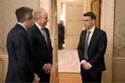 30 January 2025; Republic of Ireland captain Séamus Coleman, right, with An Taoiseach Micheál Martin TD and Tánaiste Simon Harris TD, left, before being presented with a Presidential Distinguished Service Award for the Irish Abroad by President of Ireland Michael D. Higgins at Áras an Uachtaráin in Dublin. The Awards recognise the service given to this country or to Irish communities abroad by those who live outside Ireland. Photo by Stephen McCarthy/Sportsfile