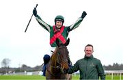 1 February 2025; Paul Townend celebrates on Final Demand, along with groom David Porter after winning the Nathaniel Lacy & Partners Solicitors Novice Hurdle during day one of the Dublin Racing Festival at Leopardstown Racecourse in Dublin. Photo by Shauna Clinton/Sportsfile