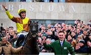 1 February 2025; Paul Townend celebrates on Galopin Des Champs, along with groom Adam Connolly, after winning The Paddy Power Irish Gold Cup during day one of the Dublin Racing Festival at Leopardstown Racecourse in Dublin. Photo by Shauna Clinton/Sportsfile