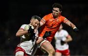1 February 2025; Mattie Donnelly of Tyrone is tackled by Ben Crealey of Armagh during the Allianz Football League Division 1 match between Armagh and Tyrone at BOX-IT Athletic Grounds in Armagh. Photo by Ben McShane/Sportsfile